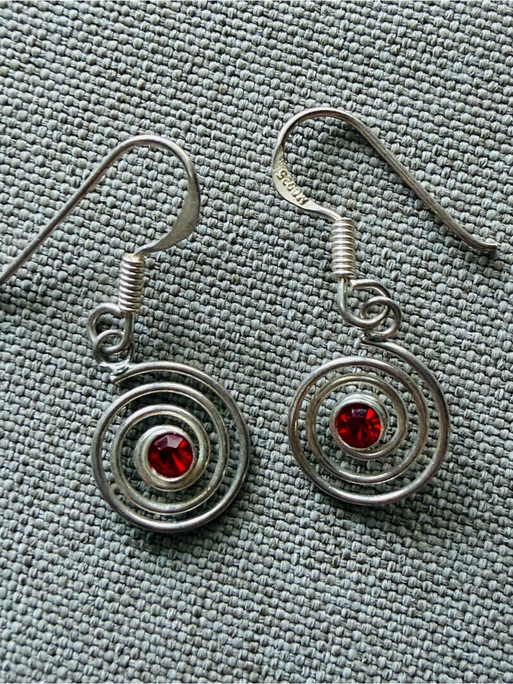 Sterling Silver Spiral Drop Earrings with Red Gem